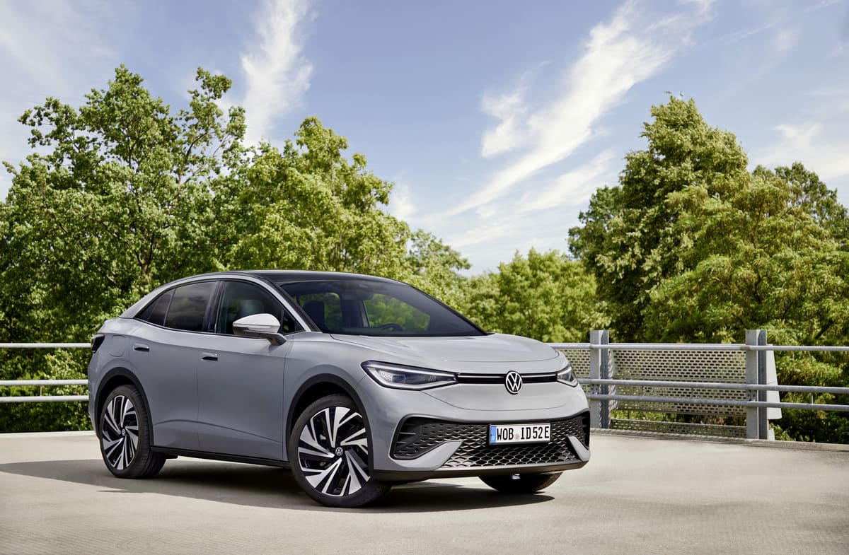 A sleek Volkswagen IDX electric SUV showcasing modern design and eco-friendly technology on a city street.
