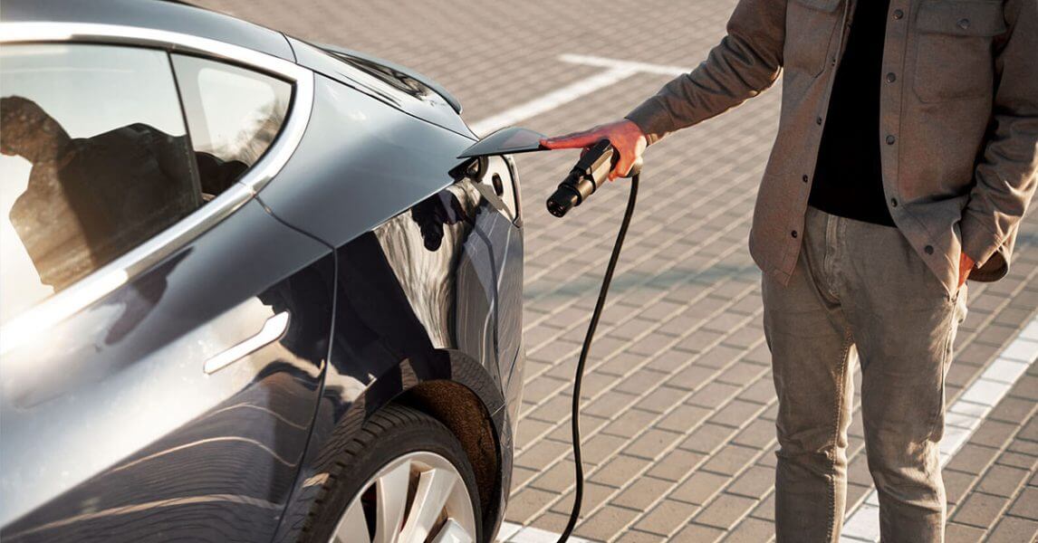 Man charging EV