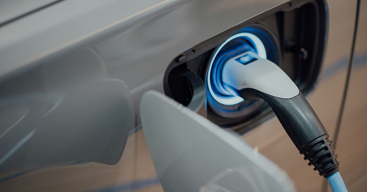 An electric vehicle connected to a charging station, ready to recharge its battery for sustainable travel.