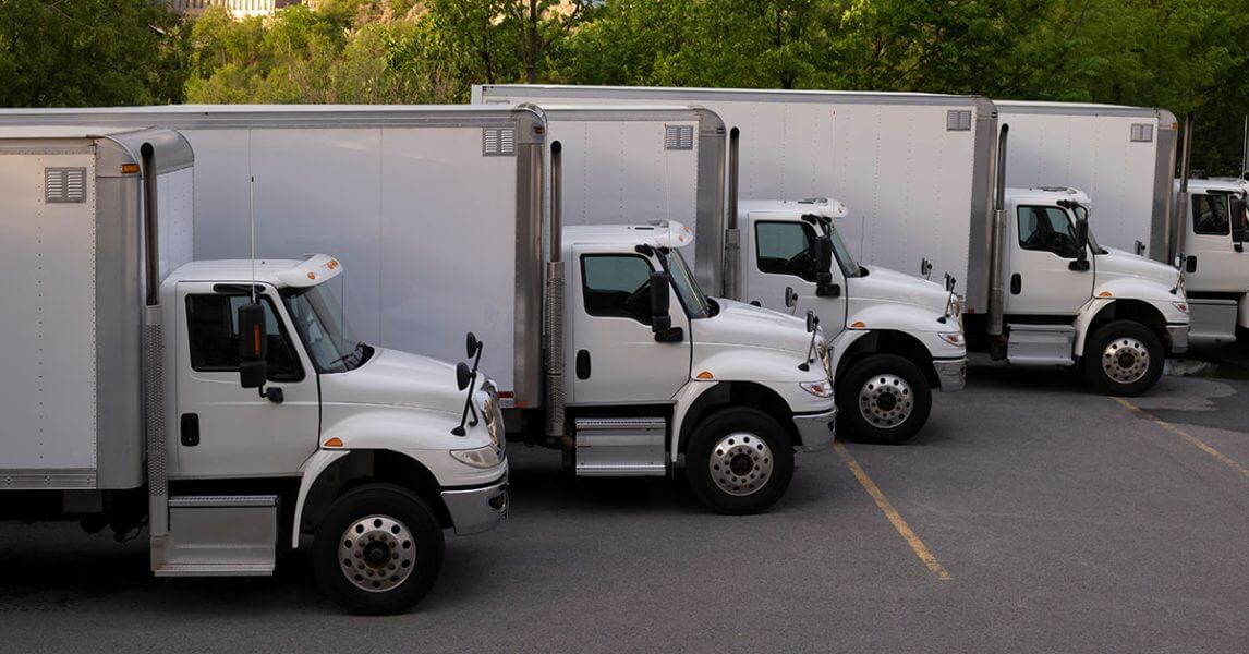 Five white trucks