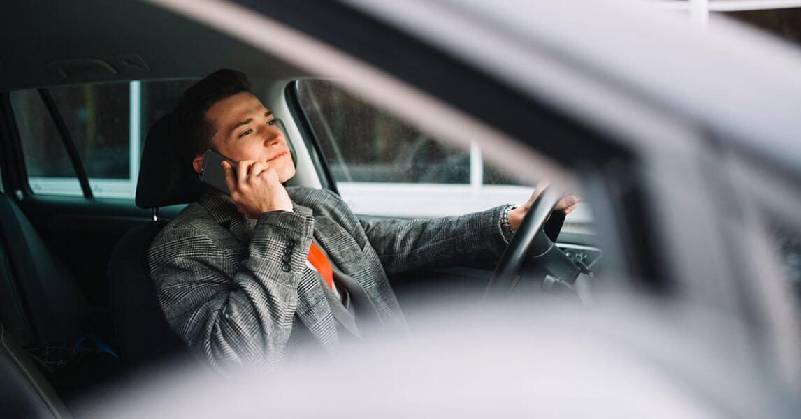 Man on a call while driving