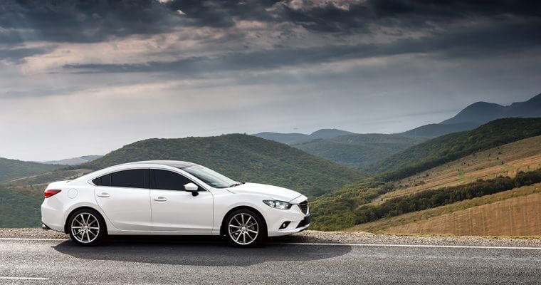 White EV parked on side of road