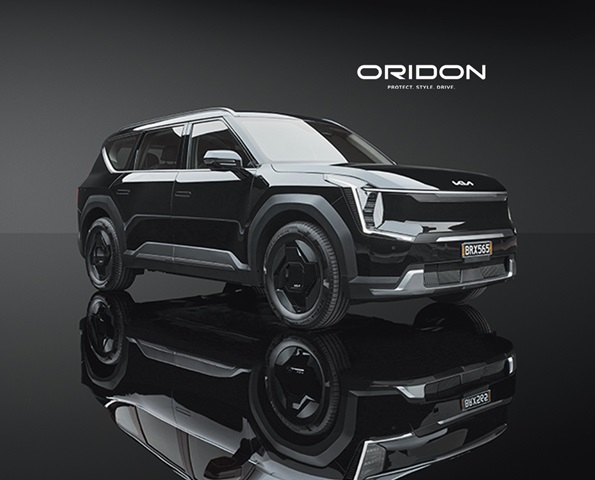 Oridion: Protect. Style. Drive. Glossy black Kia EV9 in-studio product shot.