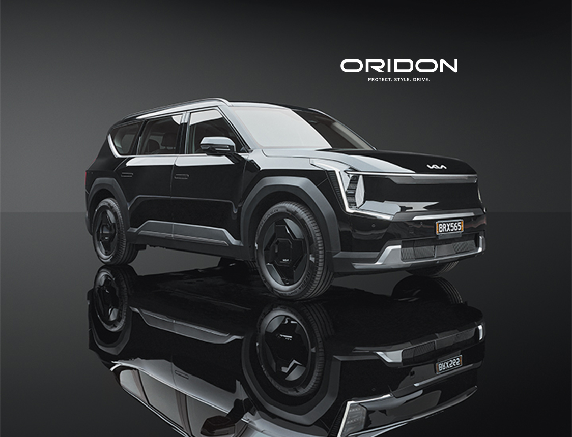 Glossy black Kia EV9 in-studio product shot.