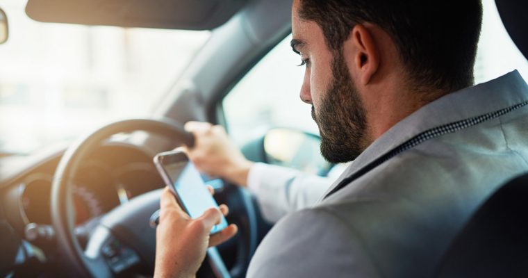 Road-safety-campaigns-are-we-getting-the-message Man driving while on phone