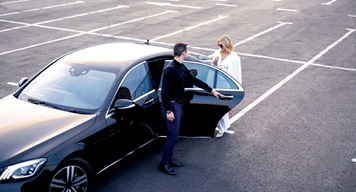 SGF_Onward_People_RGB_LR_36-medium Person opening a vehicle door for someone else